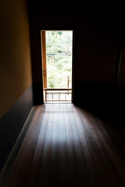 a doorway to another room, with the light coming through