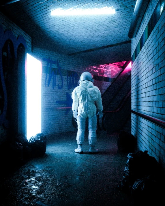 an astronaut is seen walking down an escalator