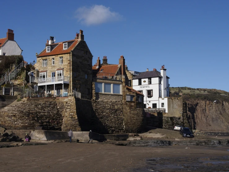 a building with a tower sitting in front of the ocean