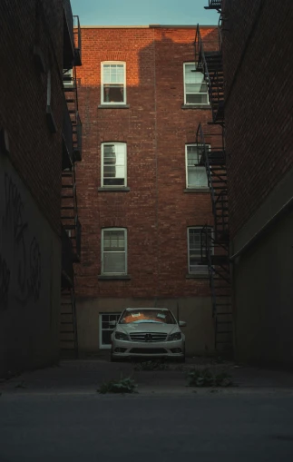 the car parked on the street under the building