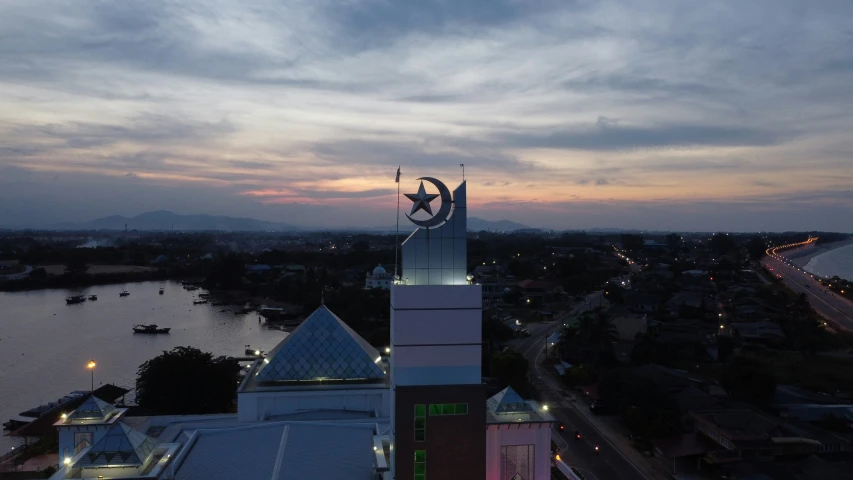 the top of a building with a tower with a clock