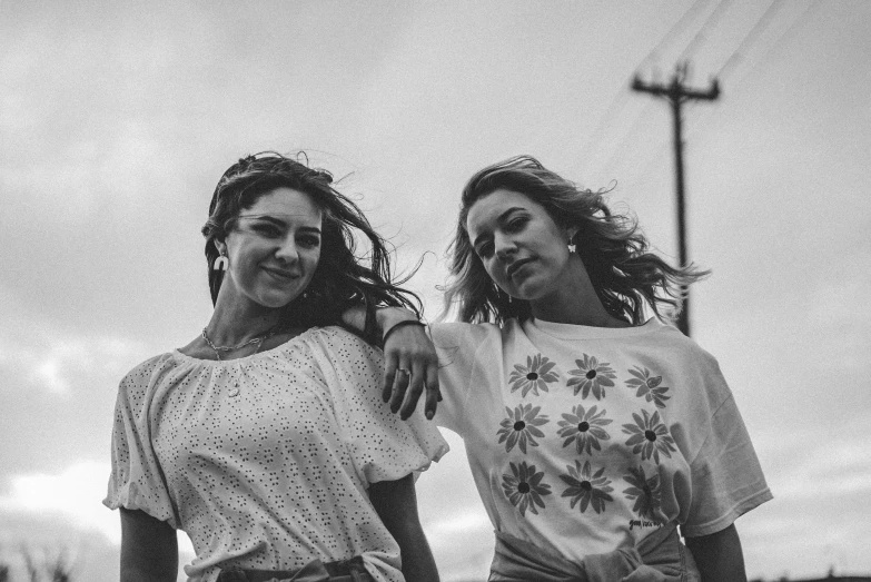 black and white po of two women wearing tops