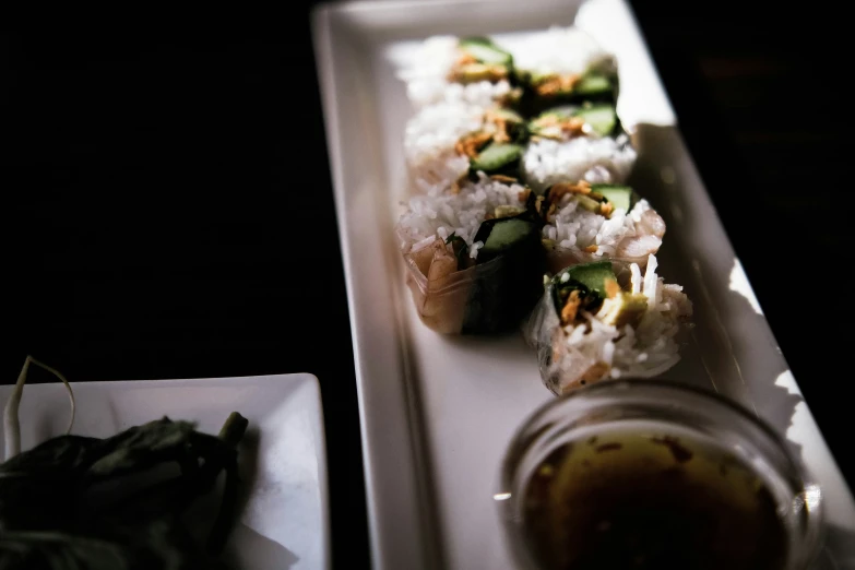 many small slices of food on top of a long plate