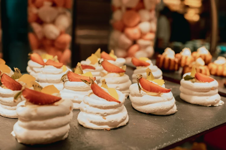 this table is loaded with pastry creations and cupcakes