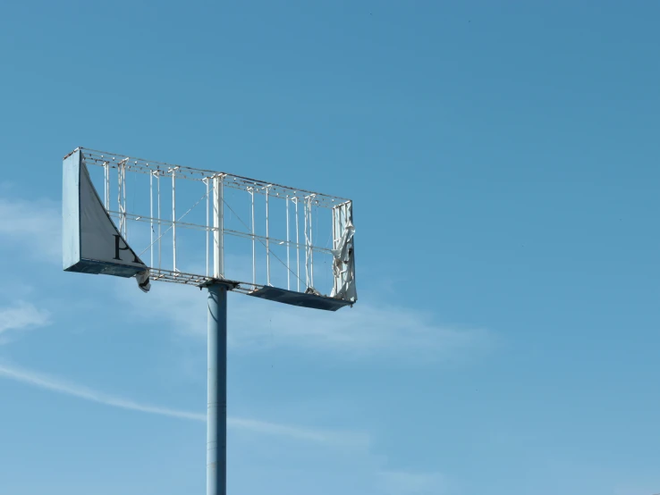 a metal and glass fenced in basketball court