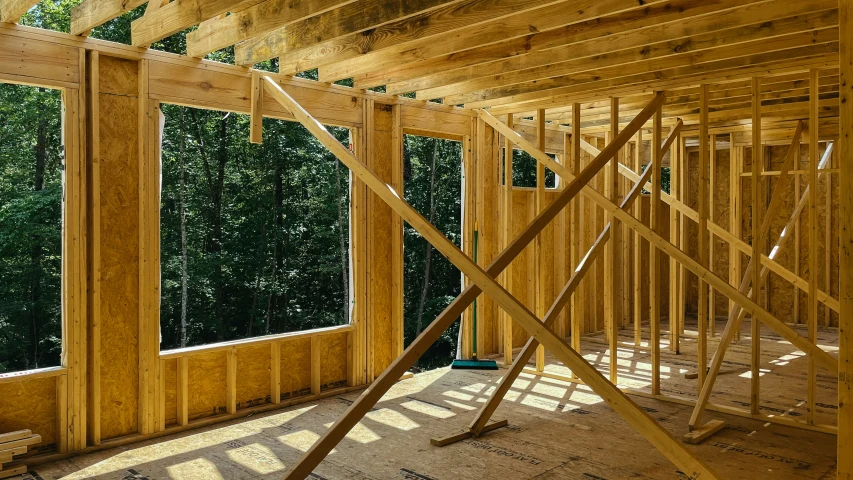 inside of a house with wood framing under construction