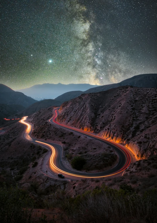 a highway with lights going into the middle of the road