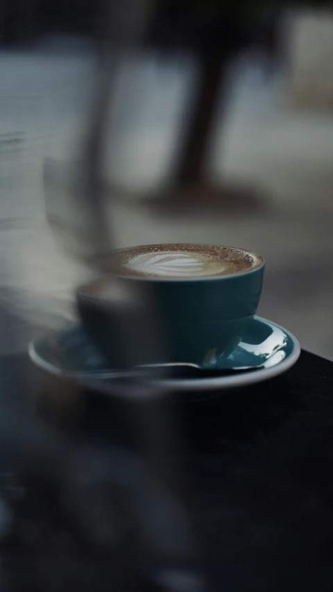 cup sitting on the table in the middle of the afternoon