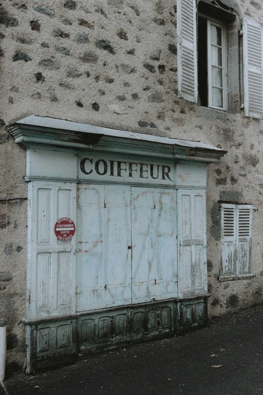 a run down building with the windows closed