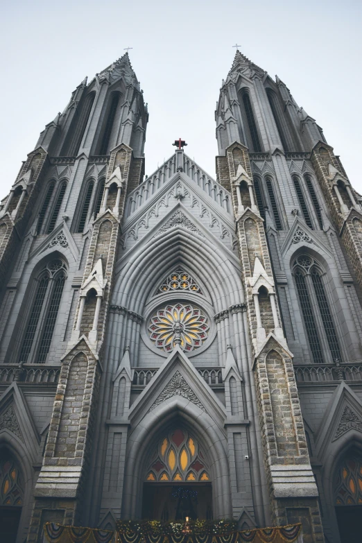 a gothic cathedral with stained glass windows and steeples