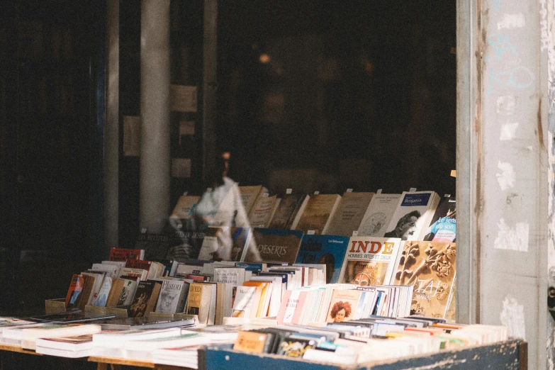 a wooden table topped with lots of books