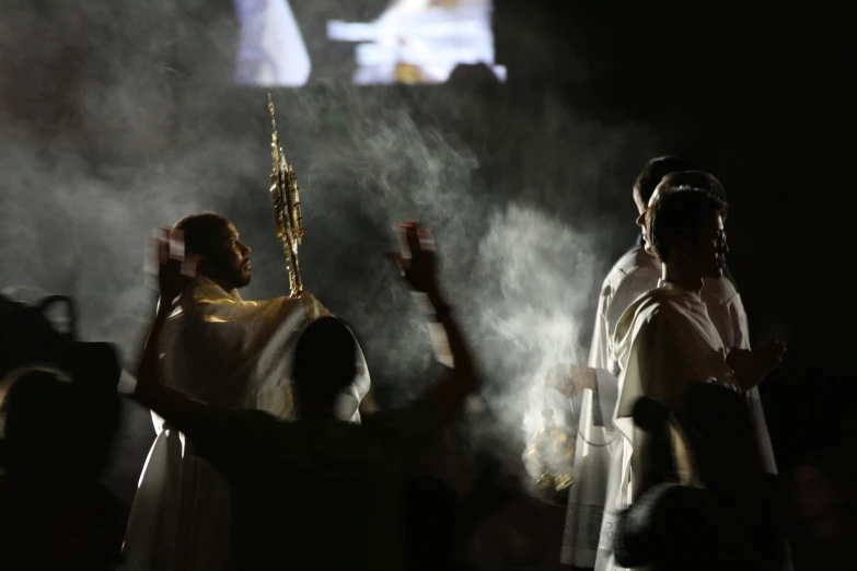 jesus's  appears to be appearing through the smoke