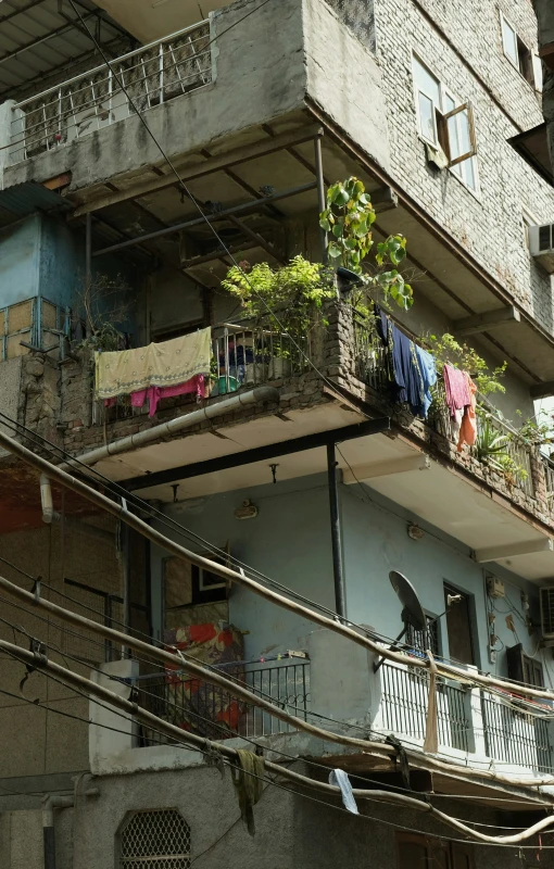 a building is covered in clothes and trees