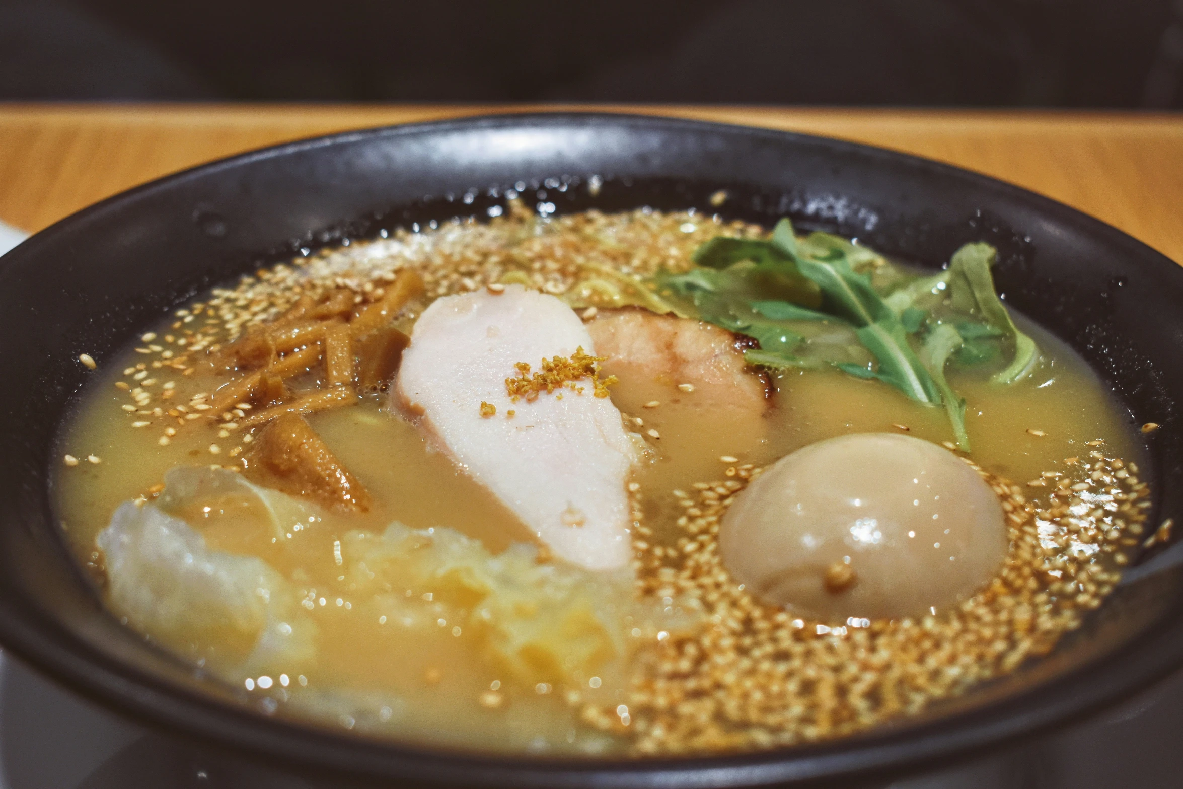 a bowl filled with soup and other food items