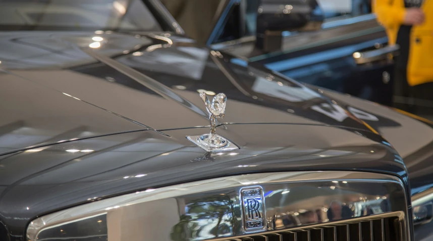 an antique classic car is displayed at a museum