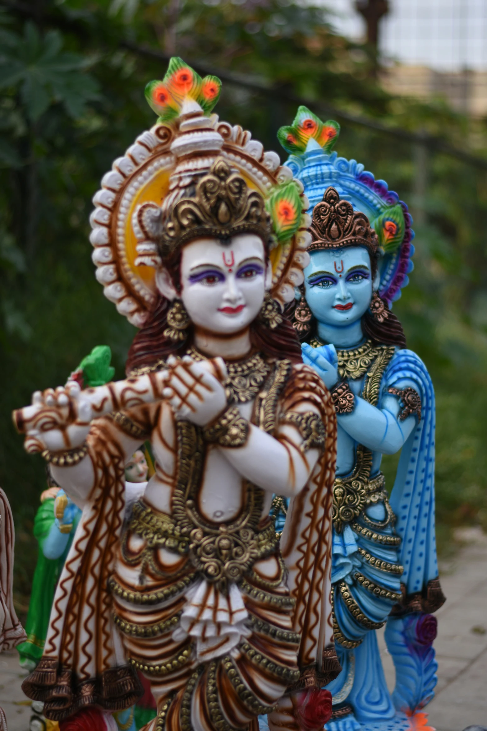 two different types of colorful colored art statues