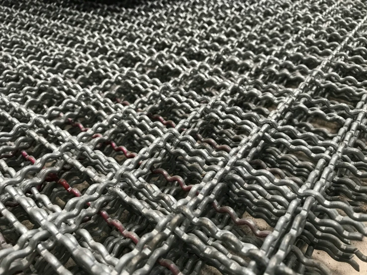 an iron grid that has been laid together on the ground