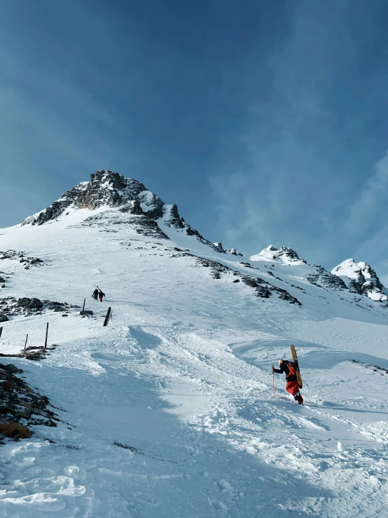 a man flying through the air while riding a snowboard