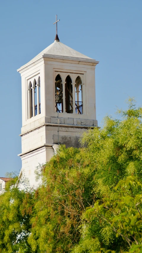 an old stone clock tower with the clock face at the top