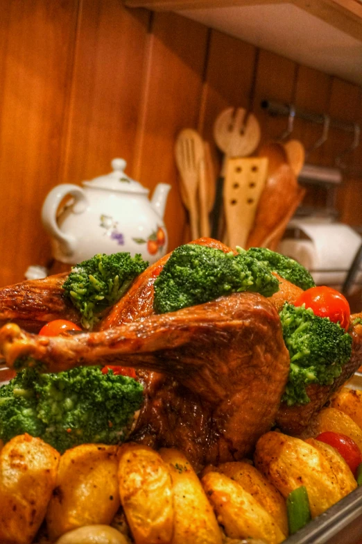 some vegetables and some meat on some pans