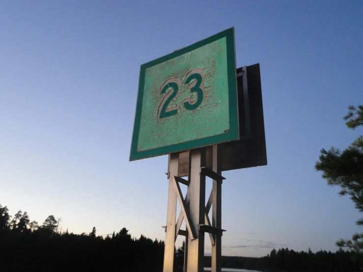 the numbers twenty twenty twenty three sign on the side of a street