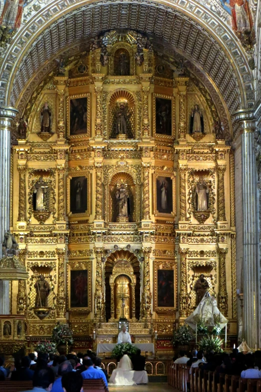 a group of people in front of a church altar