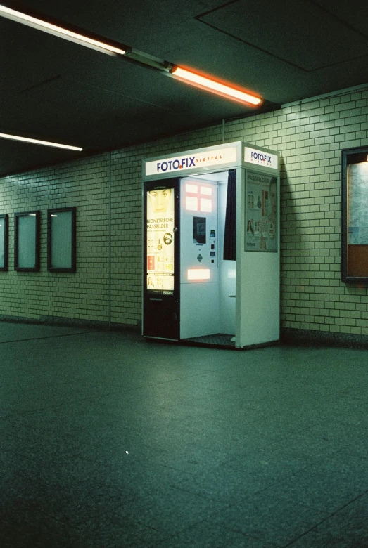 an automated machine is set up inside of a subway station