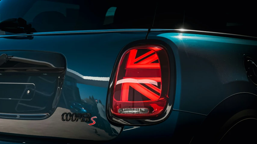 the rear light of a car that has the union jack and a british flag on it