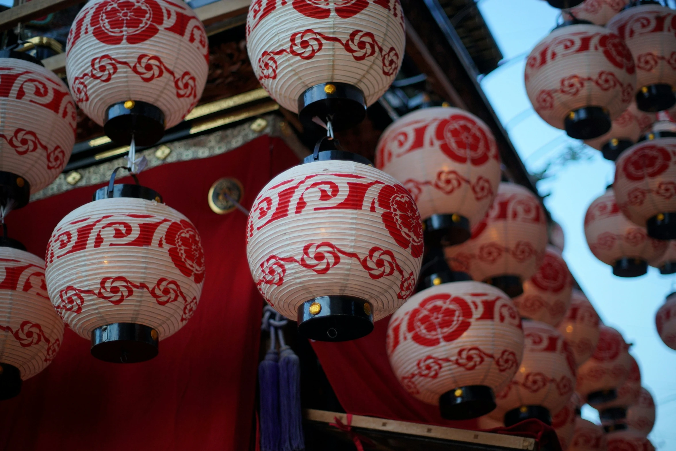 a group of red lamps hung next to each other