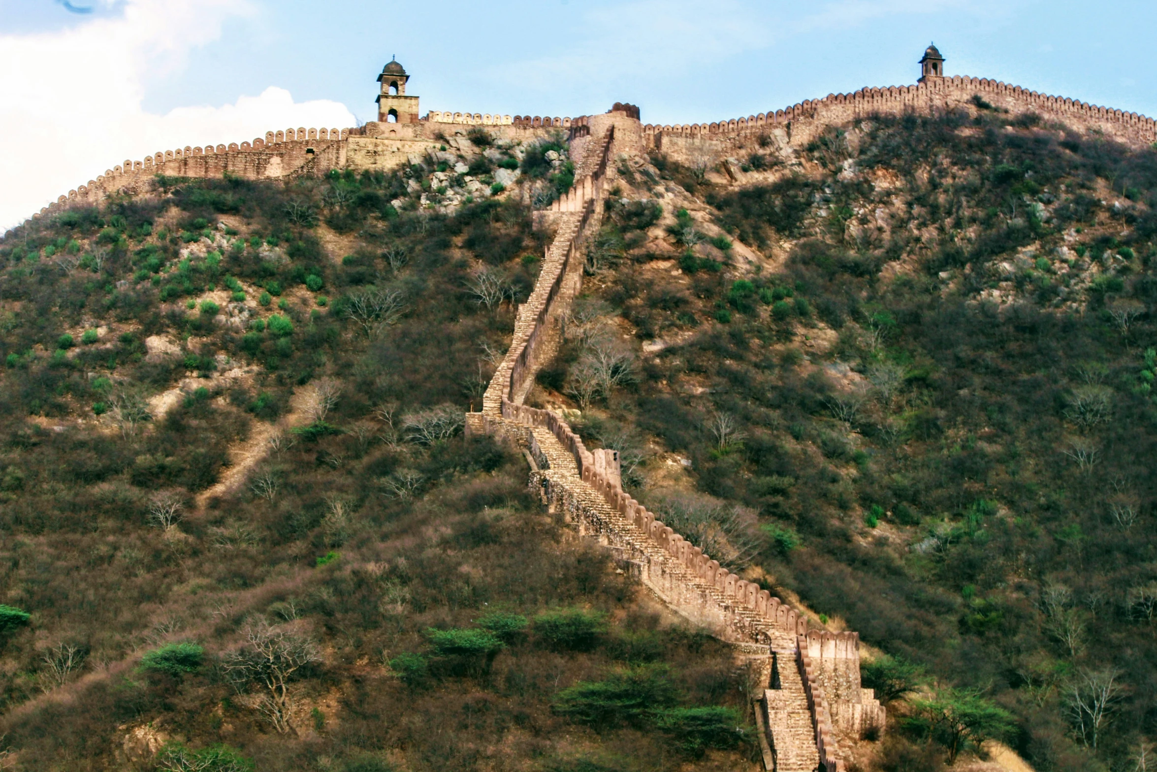 a huge hill that has some kind of structure on top