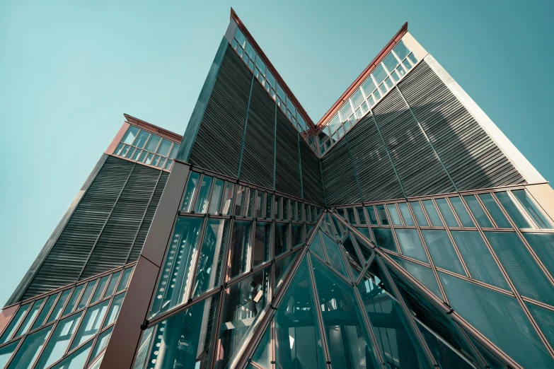 the side of a glass building with metal framing