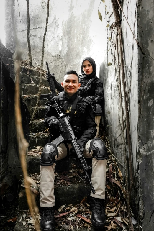 an image of a man and woman with weapons