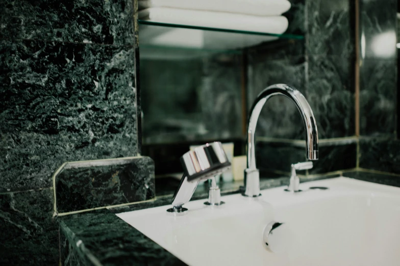 a modern bathroom sink in front of the mirror