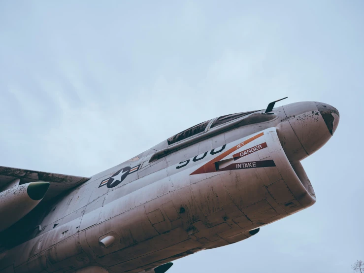 a military plane with an american flag painted on the side