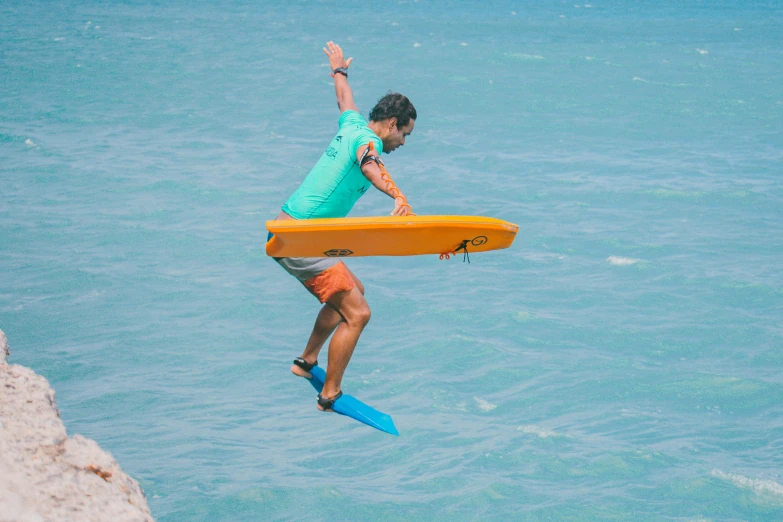 a man doing water sports on an inflatable board