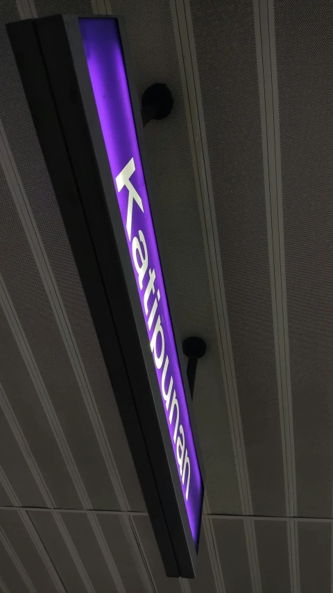 a purple sign for a bank in a building