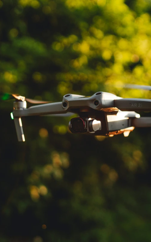 the image is taken from below a very large remote control quad