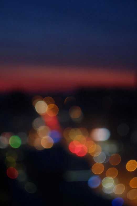 the city lights are blurred as a blur from the lights