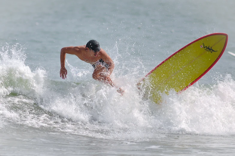 a man that is on a surfboard in the water