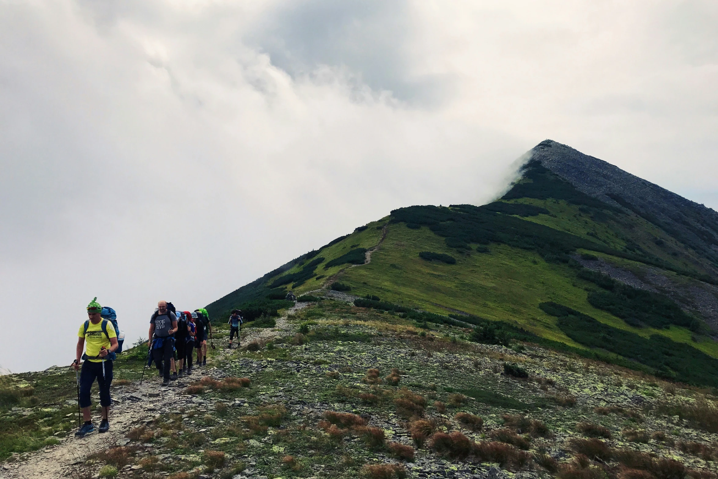 some people that are standing on a hill