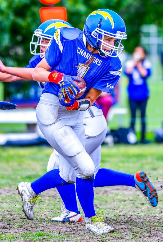 some football players running on the field during a game