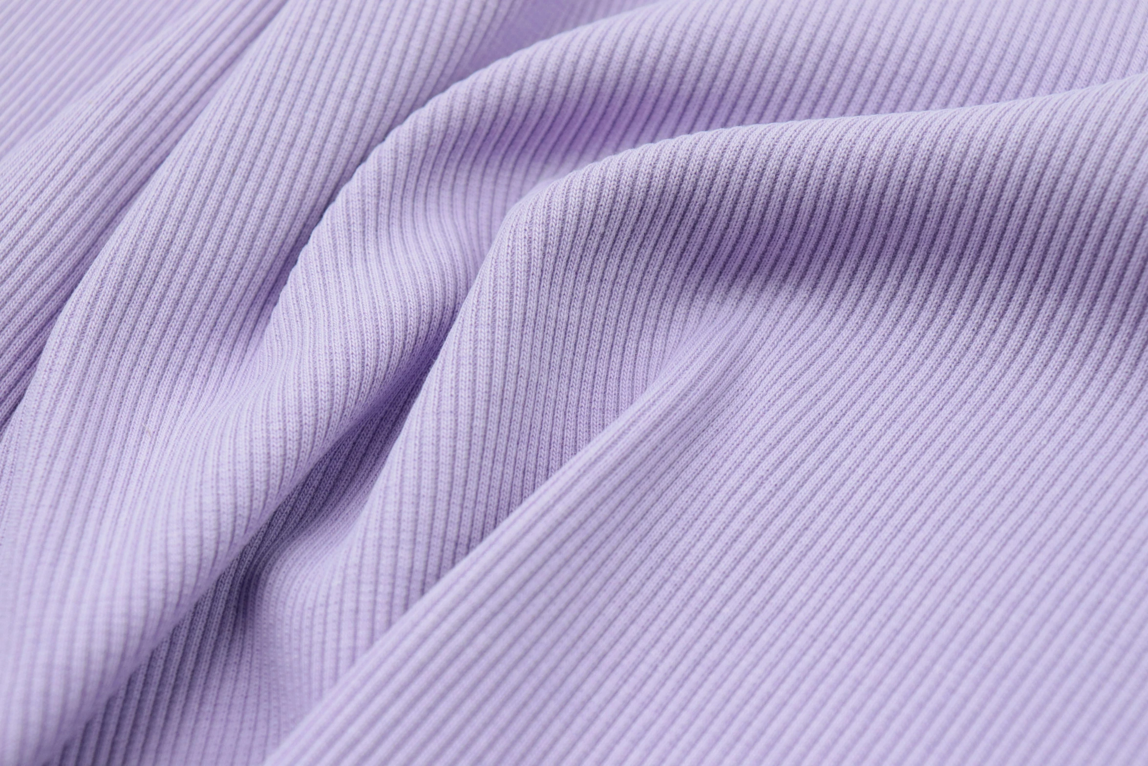 a close up view of the fabric material of a lila colored cloth