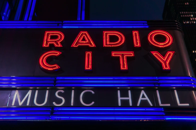 a radio city music hall sign has been lit up