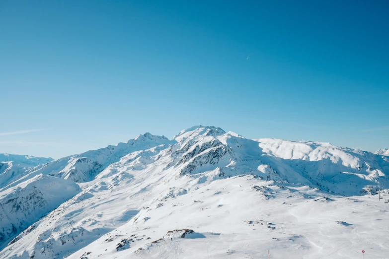 the mountains are covered in snow and are very high