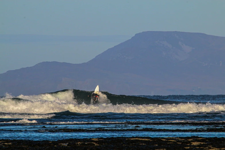 a person on a surfboard in the water