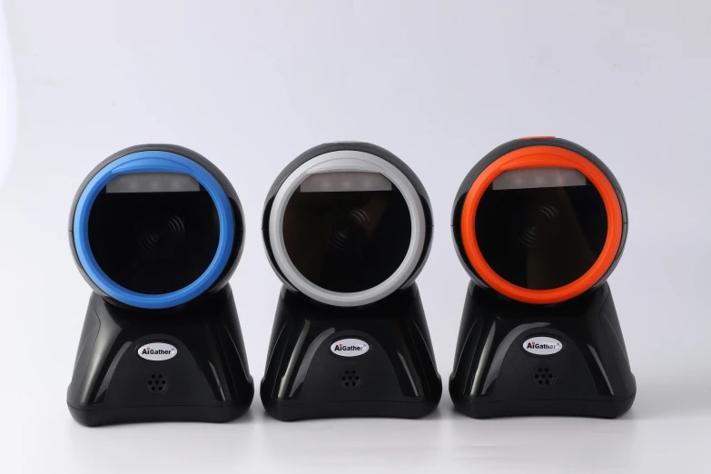 three multicolored speakers are placed next to each other