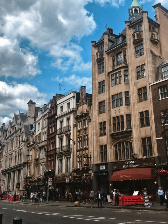 an old - fashioned building on a street corner in the city