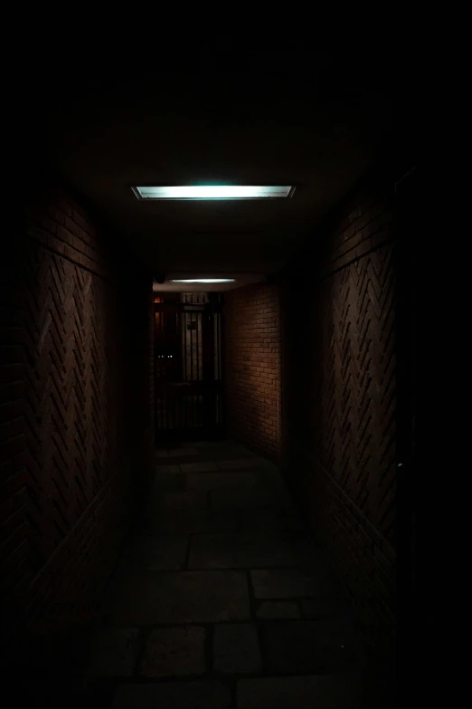 a hallway that is dark with an interesting pattern