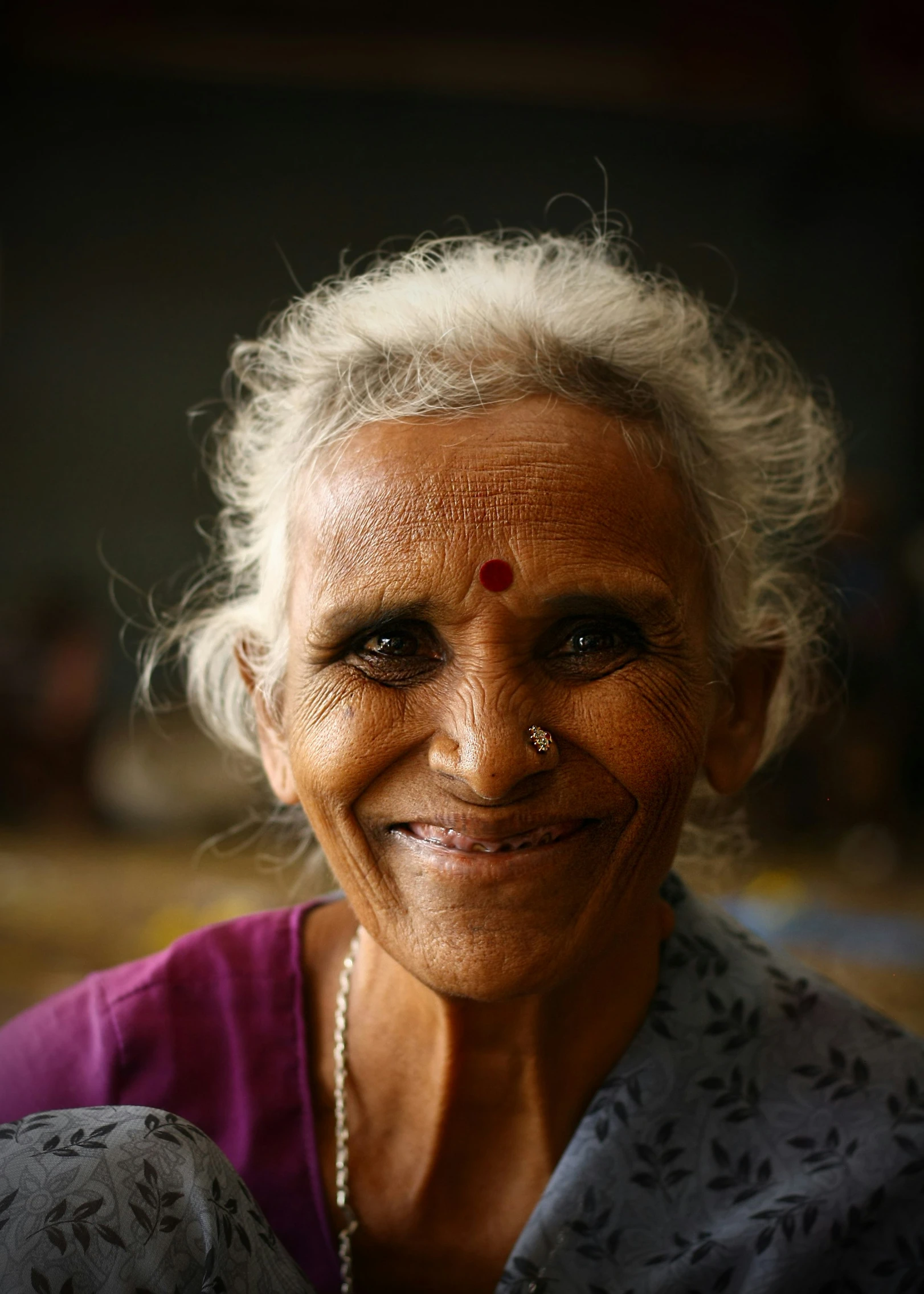 a woman smiling with her eyes closed