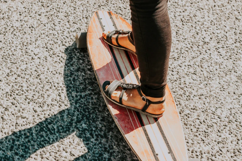 a person is standing on a skateboard in the street